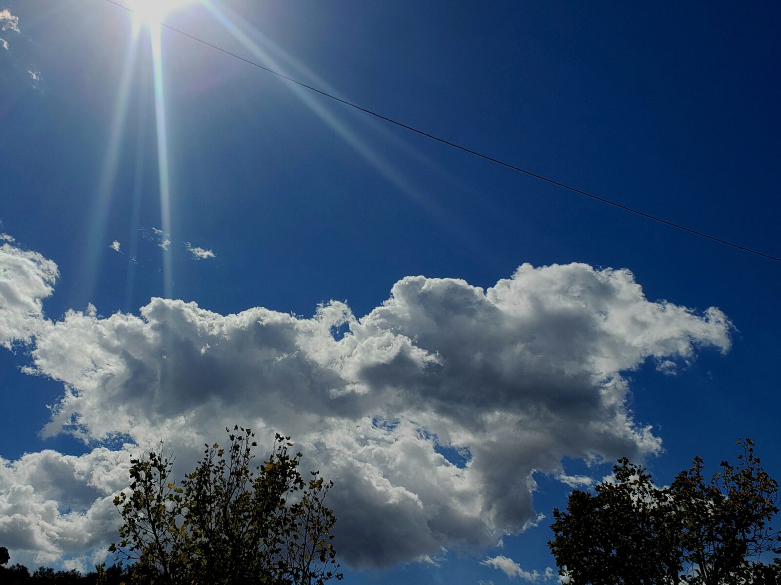 cumulus clouds sun rays